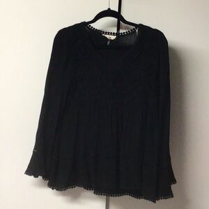 Black babydoll style top with bell sleeves and embroidered top. Size S